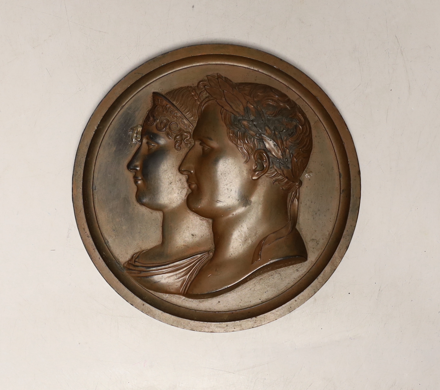 Andrieu, a patinated metal circular relief plaque, Napoleon and Josephine, 14cm diameter